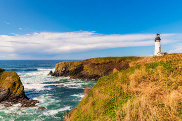 Fototapeta na wymiar Yaquina Head Lighthouse along the Pacific Northwest coast in Newport, Oregon, USA