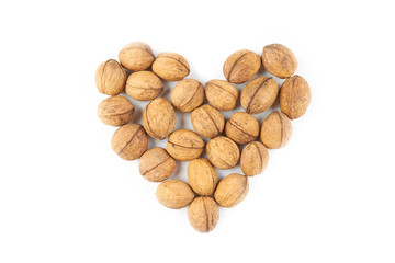 heart shape from collection of a walnuts. isolated on white background.