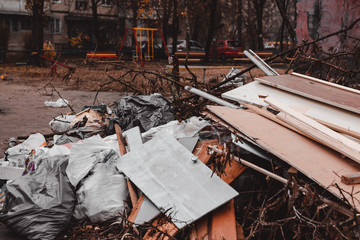 Many beer bottles near bench on children playground at summer day
