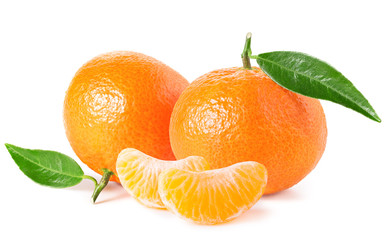 Tangerines or clementines with green leaf and slices isolated on white