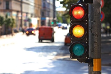  Traffic light  on the crossroad. Red and yellow light