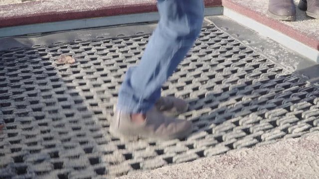 Child feets on trampoline jumping