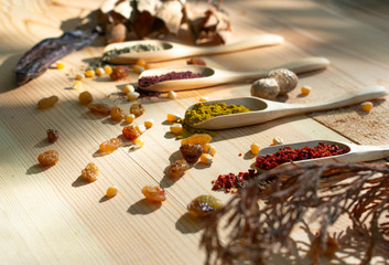 Different kinds of spices and herbal products.Natural view on wooden background.