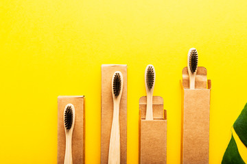 A family set of four wooden bamboo toothbrushes