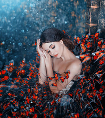 Sleeping Beauty portrait. young brunette woman, creative gentle makeup, fashion vintage glamorous collected hairstyle. Brunette girl. fantasy dress with butterflies. Blue orange art color photography © kharchenkoirina