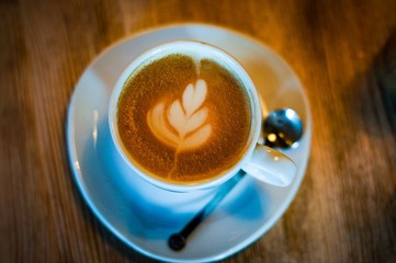 cup of coffee on wooden table