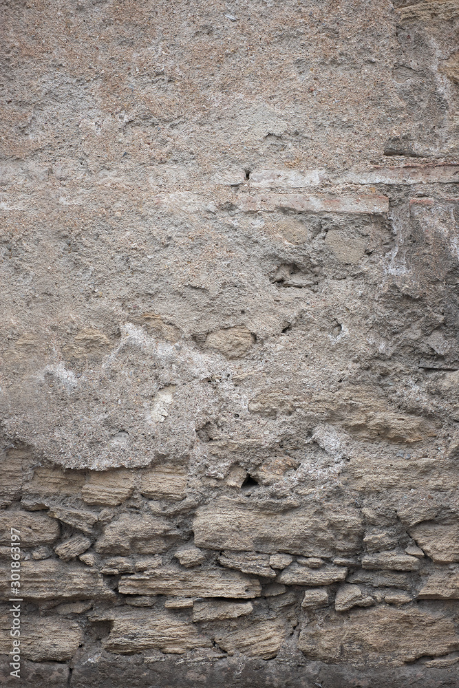 Wall mural fragment of old grungy texture with chipped paint and cracks or grey concrete wall and cement surfac