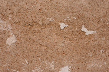 Fragment of old grungy texture with chipped paint and cracks or grey concrete wall and cement surface