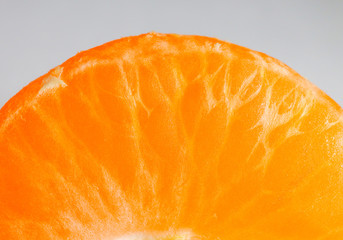 Mandarin peeled and slices on the background of macro