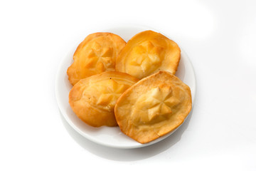 Polish traditional cheese oscypek - Oscypek isolated on white.  Oscypek on a plate.