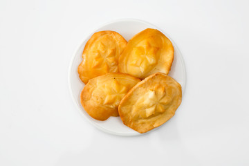 Polish traditional cheese oscypek - Oscypek isolated on white.  Oscypek on a plate.