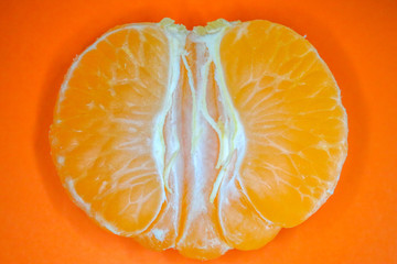 Mandarin peeled and slices on the background of macro
