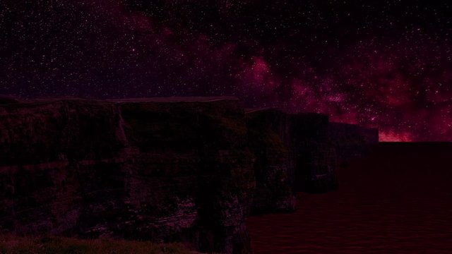 Purple colored milky way with shooting stars over the Cliffs of Moher in County Clare, Ireland.