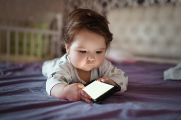child look at the screen of a mobile phone with a white blank screen: layout of a mobile...