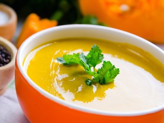 Pumpkin soup served on the table in bowl