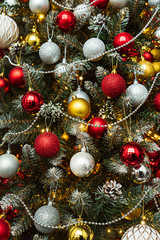 Obraz na płótnie Canvas Christmas tree with red and golden balls