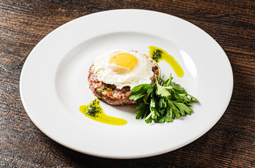 beef cutlet with egg and sauce