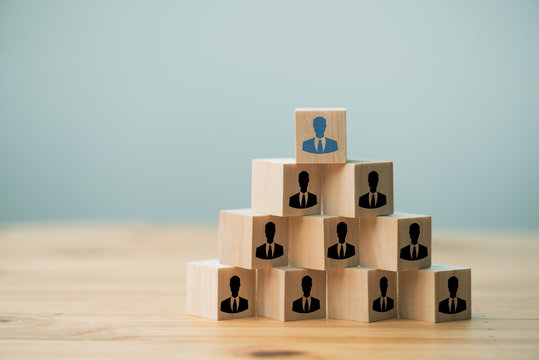Human resources idea concept.  arranging wooden cubes with people icon on office desk.