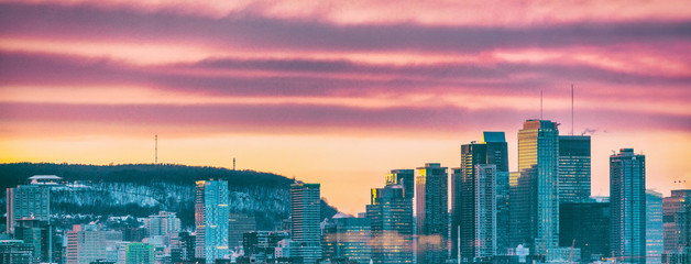 Montreal city skyline panorama of Quebec travel destination in Canada. Winter scenery background of mount royal mountain and skyscrapers buildings downtown.