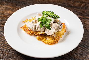 potato pancakes with mushrooms and sauce
