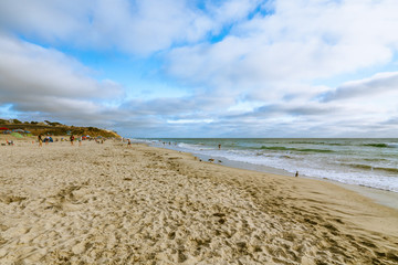 San Diego beach at sunset. Beautiful cloudy sky background