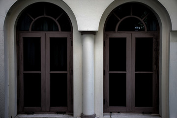 The windows of the old house are like scary things hidden away.