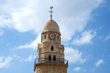Dormishon bell tower with rooster on a steeple