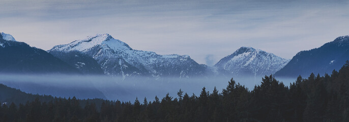 Beautiful scenic landscapes of the pacific north wests Bowen Island BC Canada.  With pristine lakes, fog, mist, and rocky beaches with mountain backgrounds.