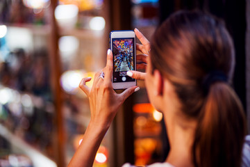 Unrecognizable woman make picture with her smartphone