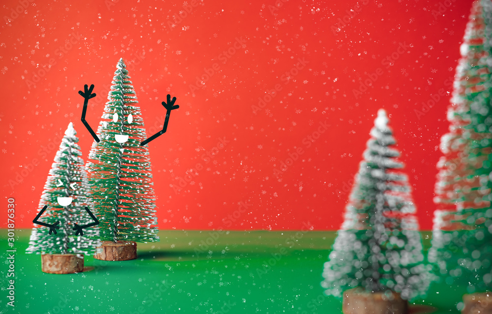 Poster christams tree with smile face emotion doodle style decoration on green table with vivid red backgro