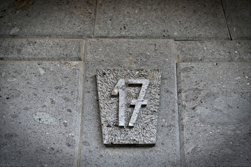 Number 17, seventeen, natural stone background.