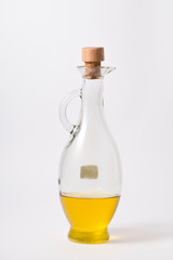 Olive oil in a bottle on white