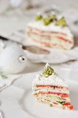 crep cake for Christmas and New Year.  Christmas tree decorations cabbage romanesco. Snack cake with salmon, avocado and soft cheese. Grains of cottage cheese play the role of snowdrifts.