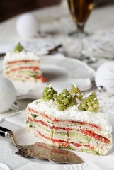 crep cake for Christmas and New Year.  Christmas tree decorations cabbage romanesco. Snack cake with salmon, avocado and soft cheese. Grains of cottage cheese play the role of snowdrifts.