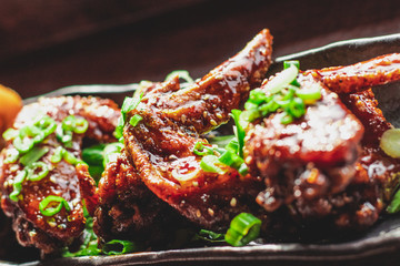 11/10/2019 Chicken wings at Japanese Restaurant. The wings were grilled with charcoal and top with Teriyaki sauce, green onion, back pepper and sesame seeds.   