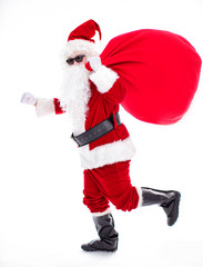 Santa Claus carrying sack full of gifts