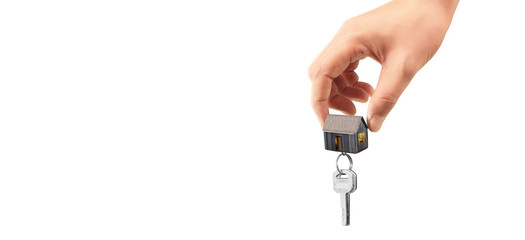 Real estate agent handing over house keys in hand