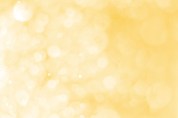 Blurred images of golden bokeh, golden bokeh circles for Christmas, Abstract.
