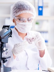 Female scientist researcher conducting an experiment in a labora