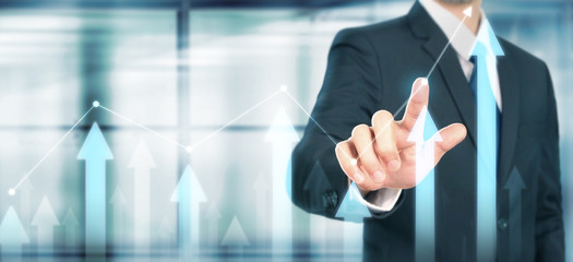 Businessman plan graph growth increase of chart positive indicators in his business