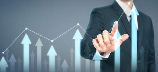 Businessman plan graph growth increase of chart positive indicators in his business