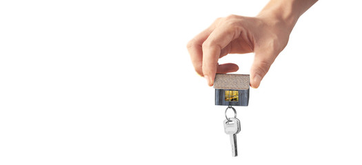 Real estate agent handing over house keys in hand