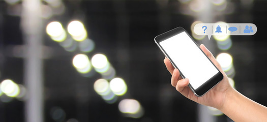 Man hand holding smartphone device and touching screen