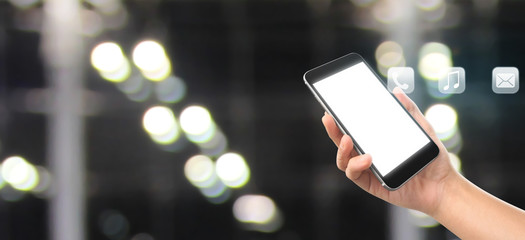 Man hand holding smartphone device and touching screen