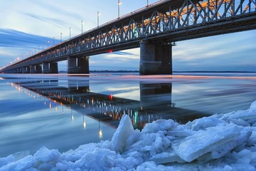 Ice floating on the Amur river. Amur bridge. Trans siberian railway. Khabarovsk, far East, Russia.
