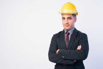 Portrait of handsome Persian businessman as engineer with arms crossed