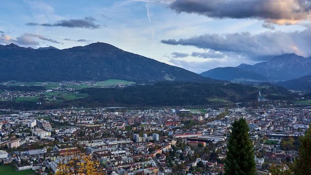 Slow panning panoramic timelapse looking over the city of Innsbruck and the alps from the Hungerberg on the Nordkette mountain range. Austria