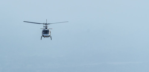 March 2017, in India/ A pilot in the  helicopter flying to transport passengers to sanjhi chhat at a Hindu shrine Vaishno devi