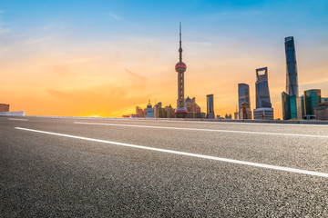 Fototapeta na wymiar Sunset architectural landscape and asphalt road in Shanghai