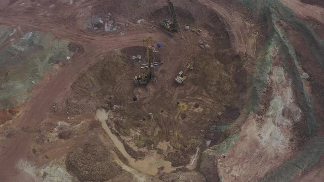 Construction ground rig and excavator aerial surround photography, top view